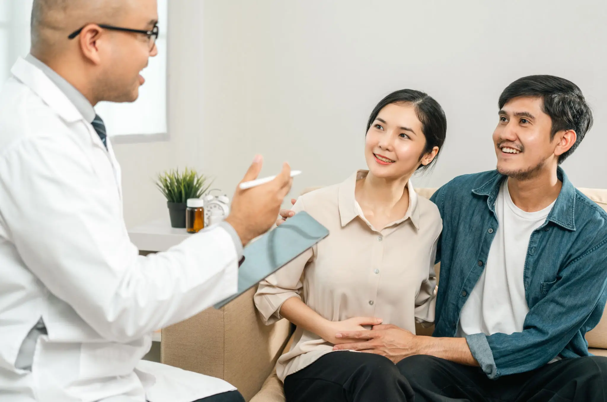 Couple consulting a doctor during a medical appointment.